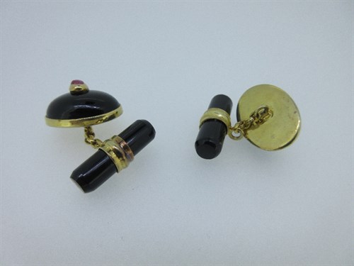 Lot 416 - A pair of onyx and ruby cufflinks