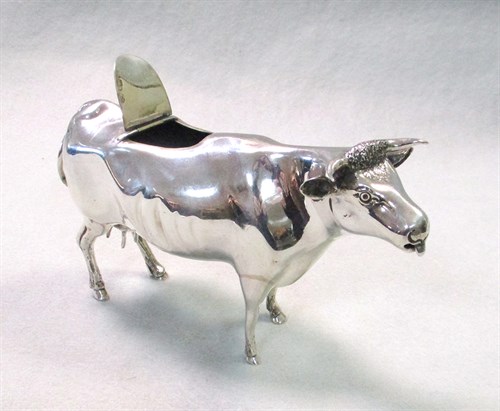 Lot 65 - A Victorian silver semi-naturalistic cow creamer
