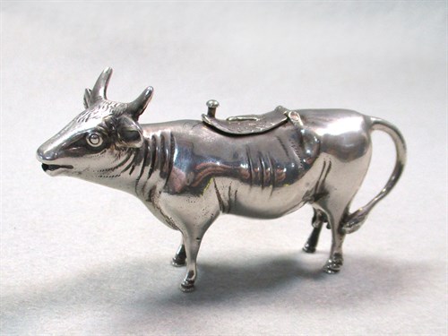 Lot 9 - A German miniature semi-naturalistic cow creamer