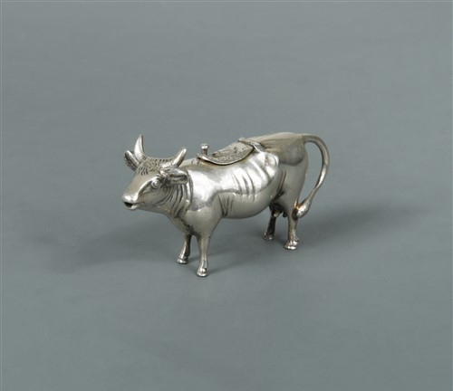 Lot 505 - A German miniature semi-naturalistic cow creamer