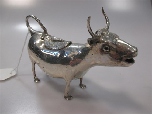 Lot 151 - A Schuppe style continental silver cow creamer...