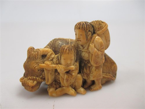 Lot 99 - Tomochika, a Japanese ivory netsuke of two...