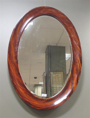 Lot 314 - An oval grain effect framed wall mirror with a...