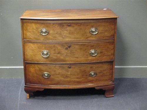 Lot 398 - A Regency mahogany bow front chest of drawers,...