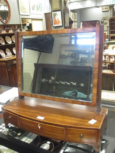 Lot 424 - A George IV mahogany bow front dressing table...