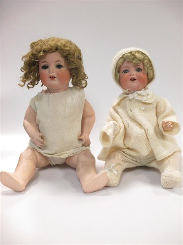Lot 35 - Three bisque head dolls and a composition head...