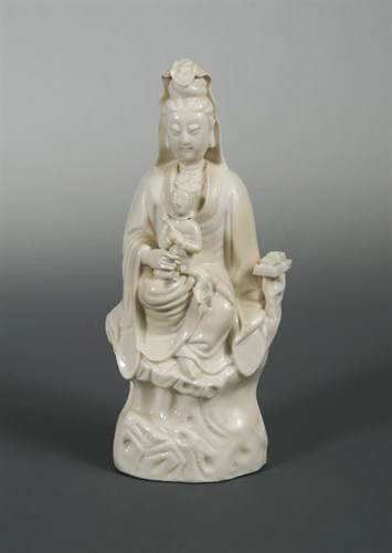 Lot 102 - A Dehua Guanyin with a child, Qing dynasty