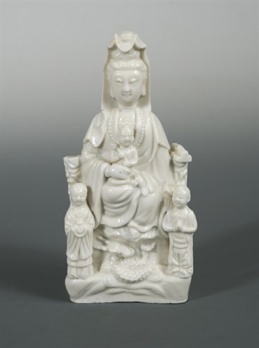Lot 134 - A Dehua Guanyin with a child and her acolytes, 19th or 20th century