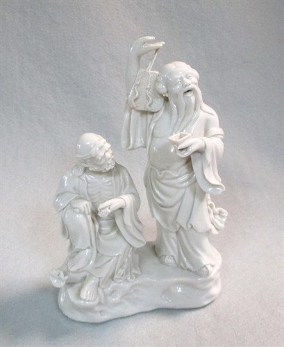 Lot 137 - A Dehua group of two immortals, 20th century