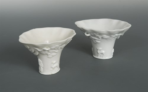 Lot 105 - Two Dehua Rhinoceros horn-form libation cups, Qing dynasty or later