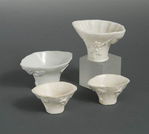 Lot 106 - Four small Dehua Rhinoceros horn-form libation cups, Qing dynasty or later