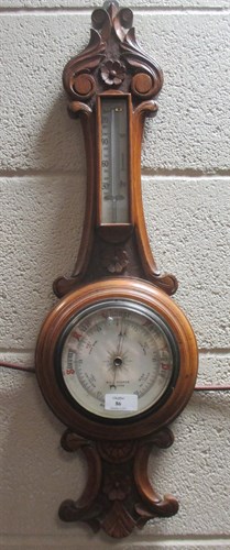 Lot 86 - An aneroid barometer, bookrest, letter rack...