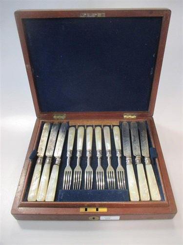 Lot 155 - A canteen of 12 pairs of silver bladed dessert...