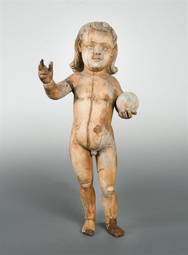 Lot 194 - A late 17th or early 18th century carved limewood figure of a putto, possibly Italian
