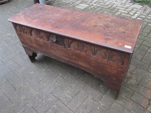 Lot 387 - A 17th century elm coffer with later carving...