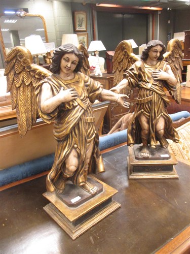 Lot 80 - A pair of painted carved wood and gesso angels,...