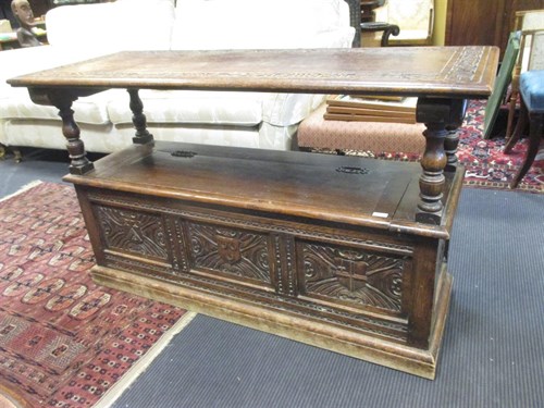 Lot 392 - A 1920's carved oak Monks bench, with folding...
