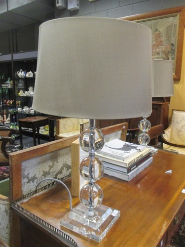 Lot 282 - A pair of modern up-tapering glass ball lamps (2)