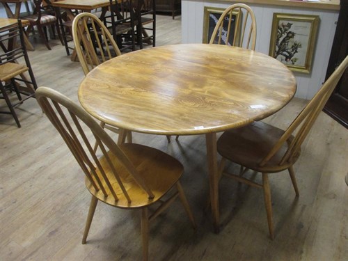 Lot 412 - An Ercol table and 4 chairs