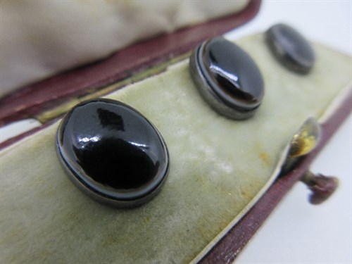 Lot 233 - A cased set of three Russian 19th century banded agate shirt studs