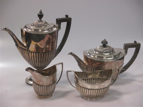 Lot 149 - A George V silver four piece tea and coffee...