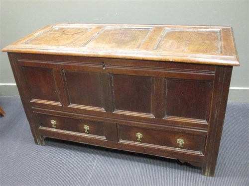 Lot 321 - An 18th century oak mule chest with panelled...