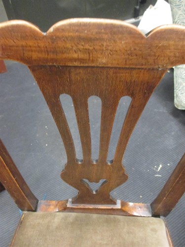 Lot 371 - A set of four county Chippendale style chairs...