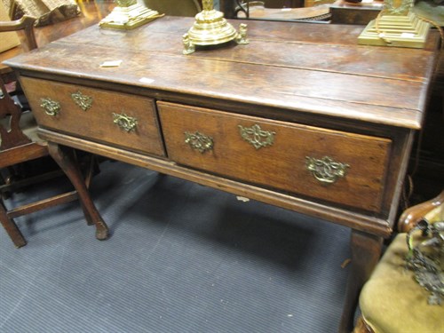 Lot 390 - A late 18th century oak sideboard with two...