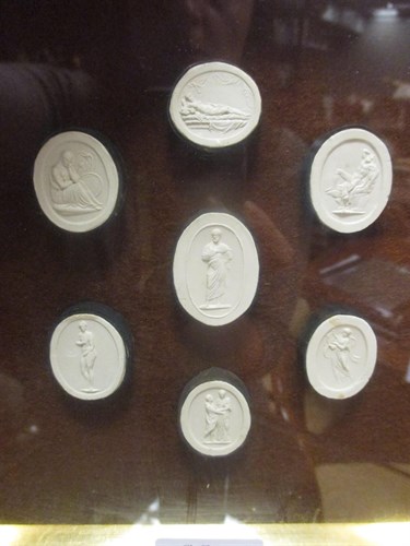 Lot 36 - A cased set of seven intaglios, depicting...