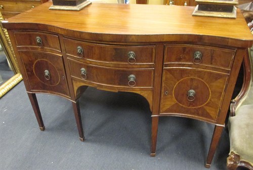 Lot 406 - A 19th century mahogany serpentine sideboard,...