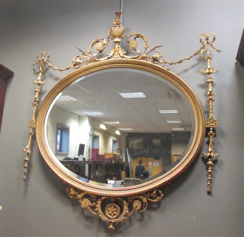 Lot 315 - A gilt and gesso Edwardian oval wall mirror...