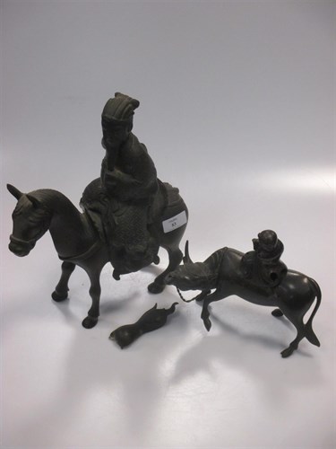 Lot 83 - An Asian bronzed metal horse and rider (loose...