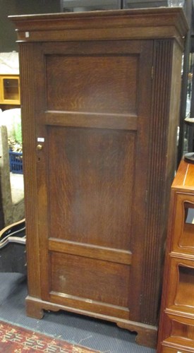 Lot 394 - An Edwardian oak wardrobe with single door,...