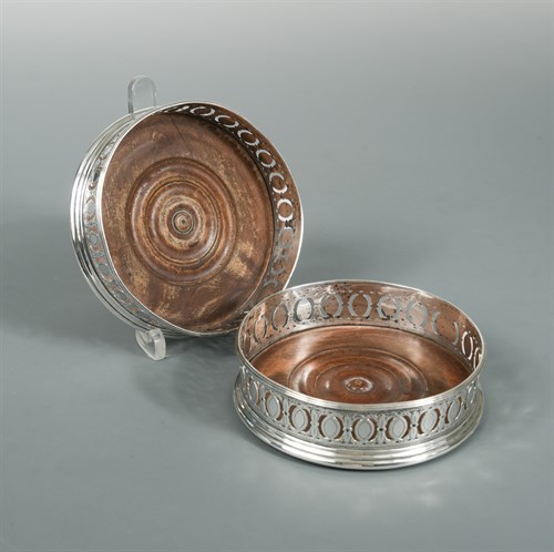 Lot 53 - A Pair of George III silver bottle coasters