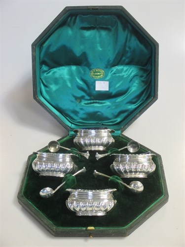 Lot 223 - A cased set of four Victorian silver salts...