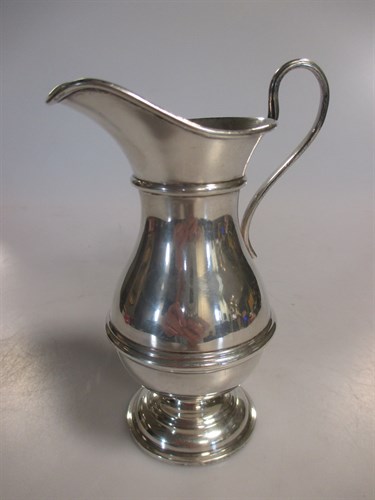 Lot 217 - A silver baluster shaped cream jug, 3.6ozt