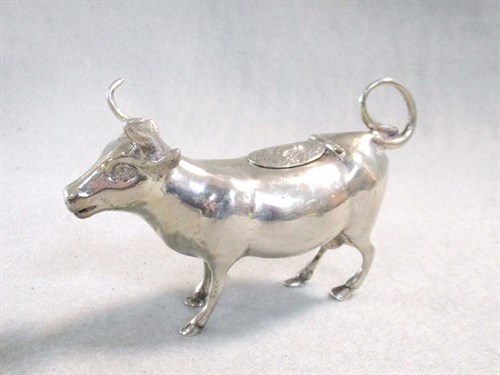 Lot 11 - A continental metalwares semi-naturalistic cow creamer