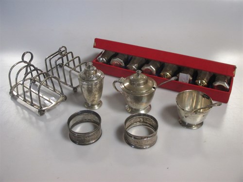 Lot 212 - Two silver toast racks, two silver napkin...