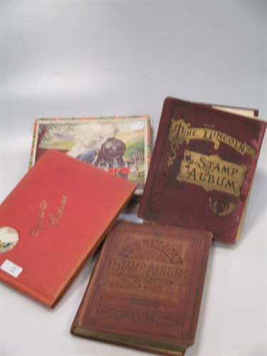 Lot 147 - Two stamp albums, together with cigarette...