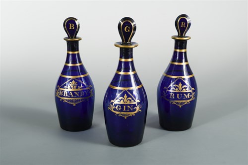 Lot 40 - Three Bristol blue glass decanters and stoppers