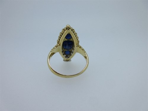 Lot 409 - An 18ct gold sapphire and diamond navette shaped ring