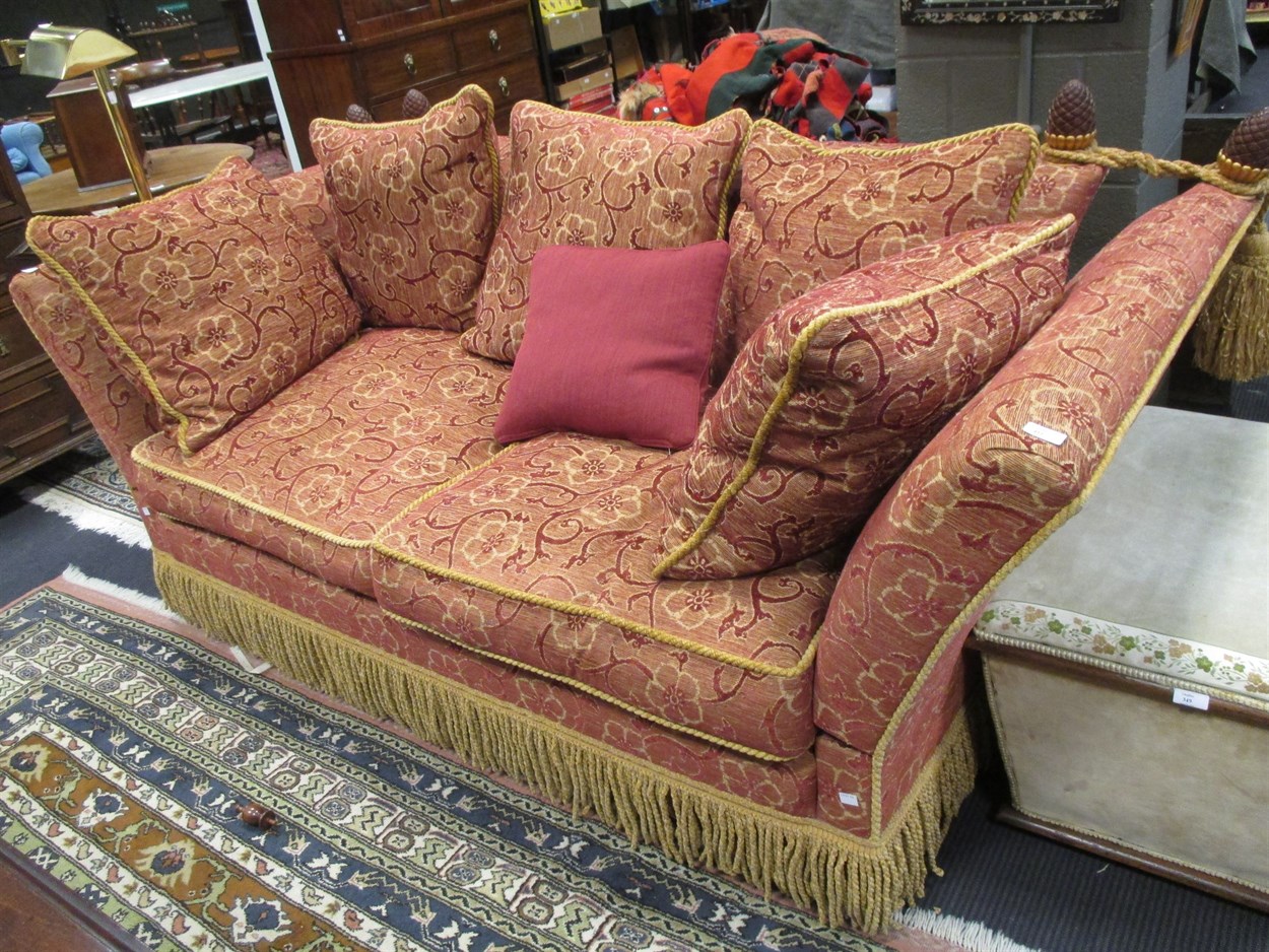 Lot 411 - A two seater Knole sofa with pine cone finials...