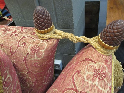 Lot 411 - A two seater Knole sofa with pine cone finials...