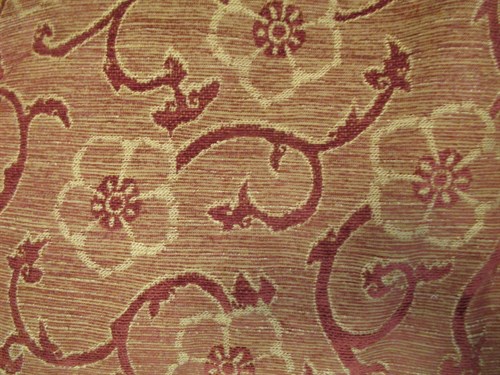Lot 411 - A two seater Knole sofa with pine cone finials...