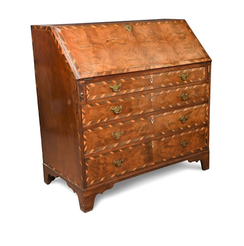 Lot 374 - A George III mahogany bureau, inlaid with...