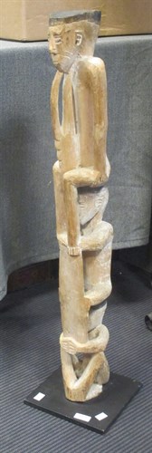 Lot 443 - A tribal carving of 3 figures above each other...