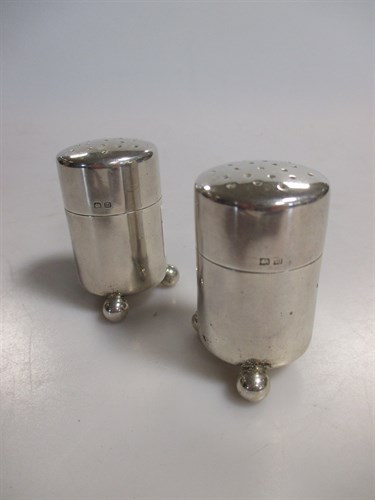 Lot 203 - A pair of silver bun pepperettes, hallmarked...