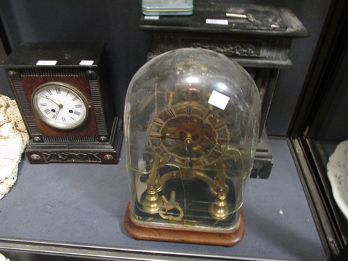 Lot 446 - A late Victorian brass skeleton clock under a...