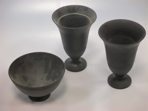 Lot 128 - A pair of Wedgwood black basalt bell shaped...