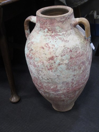 Lot 139 - A Mediterannean pottery twin handled storage...